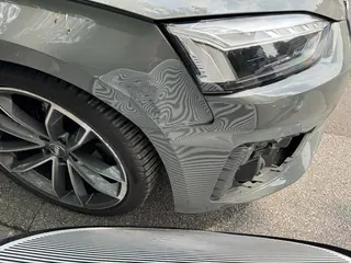 Schadensdetail audi a5 kotfluegel delle frontstossstange